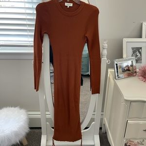 Large rust color sweater dress with ruching on side to adjust length